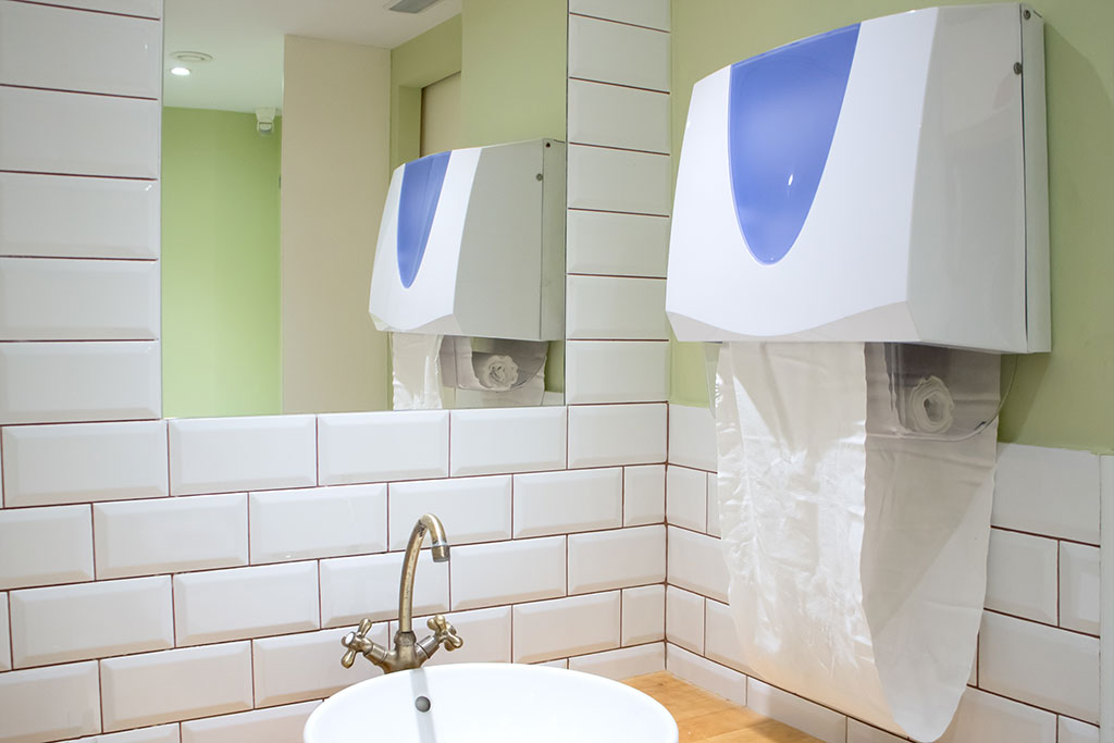 An unhygienic cloth roll towel dispenser